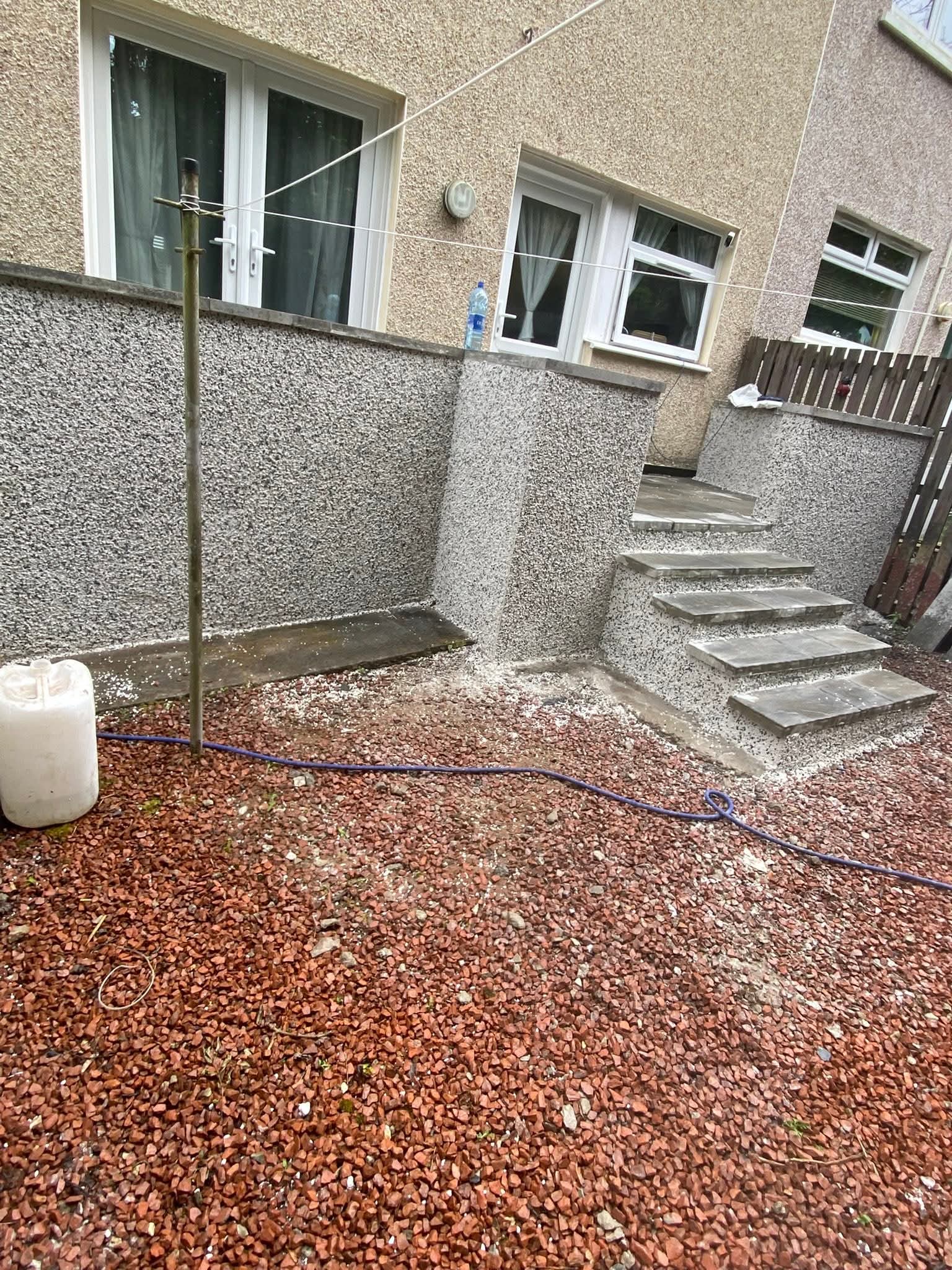 Smooth through-coloured render finish